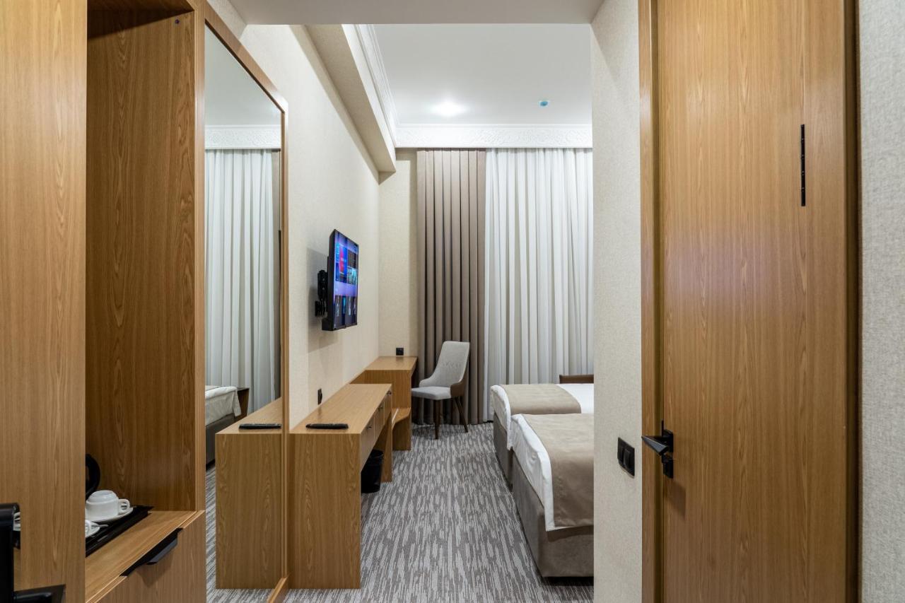 Mirzo Hotel Tasken Kültér fotó
